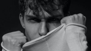 Angry mand with fists clenched by face